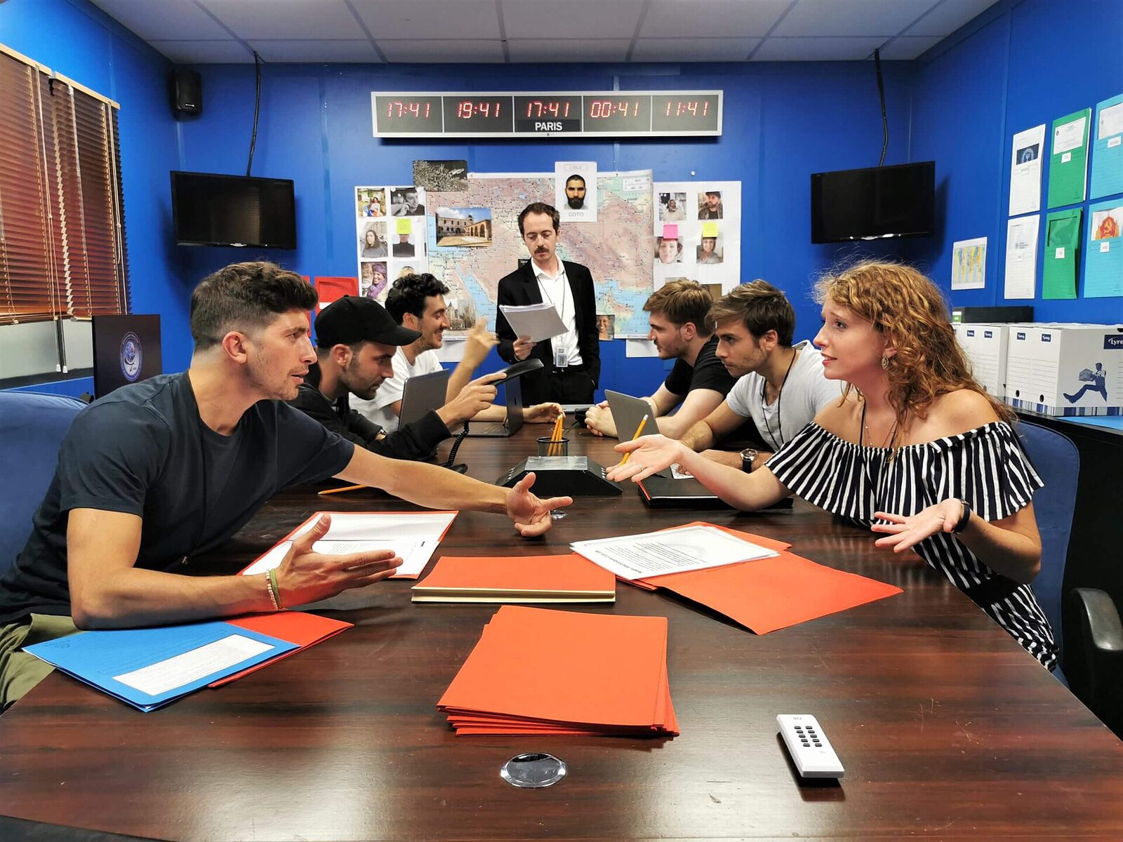 Players working together on coded notes and puzzle clues